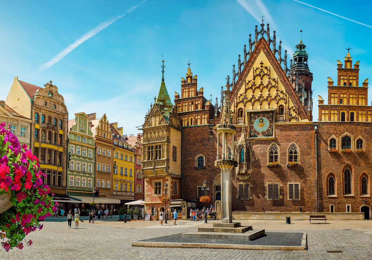 View looking across the market square towards a very ornate Town Hall in Wroclaw, Poland